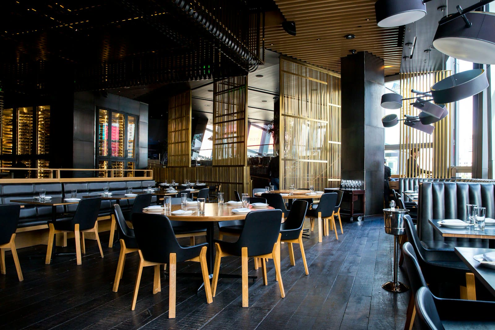 Bright restaurant interior with tables and pendant lights